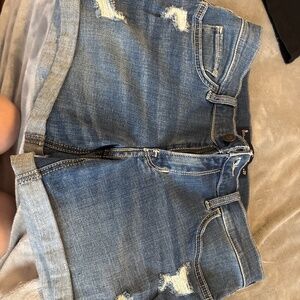 Dark wash jeans with small holes